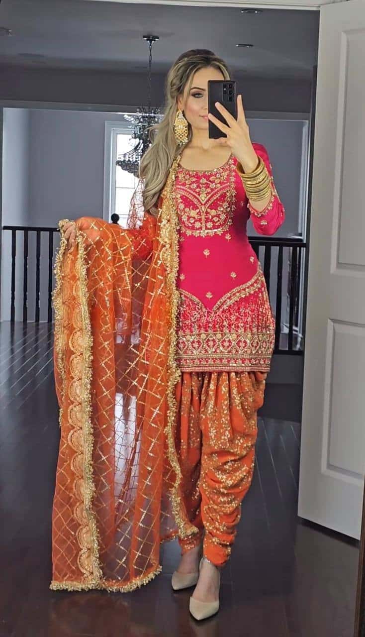 Beautiful faux georgette orange and green punjabi dhoti set
