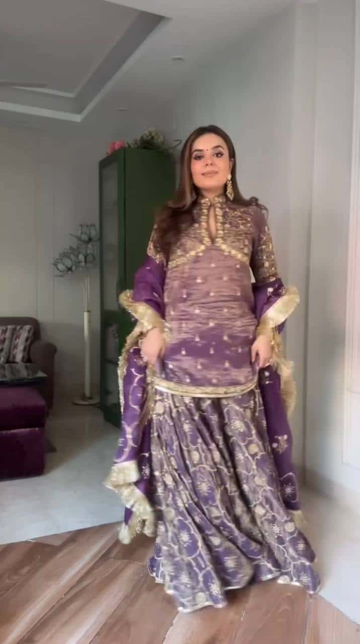 "Luxurious Pur Twil Gold Net Embroidered Suit Set with Sequence Work and Fancy Lace Border"